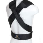 A mannequin showcases the Exxentric Squat Harness in black, with adjustable straps and a crossing pattern on the back, featuring a small Exxentric logo on the lower strap.