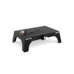 The Exxentric kBox 4 Lite Platform is a black weight training device with a compact rectangular design, featuring a footboard with a detachable handle, ideal for strength and resistance workouts.