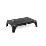 A black Exxentric kBox 4 Pro Platform with a sturdy rectangular design includes a hand crank and an underlying white cylindrical component for resistance training. kBox4 is visible on the side.