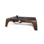 The Exxentric kBox 4 Pro Platform is a compact black and brown exercise platform featuring a central adjustment knob, cable-attached handle, and sturdy legs. Designed for strength training, it sports a minimalist design with #KBOX4 branding.