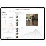 A tablet displays Enode Software License analyzing an Olympic clean lift, featuring a video of a person lifting a barbell, velocity charts, lift stats, and workout tracking options.