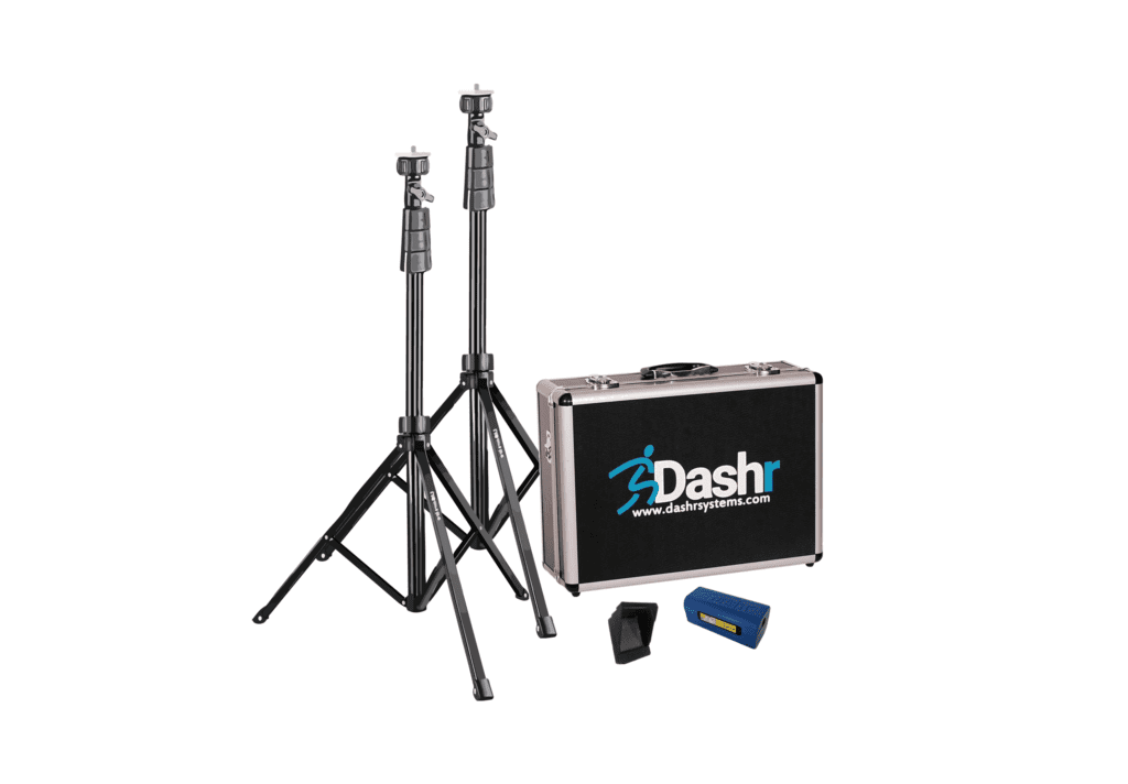 The image displays the Dashr Standard Kit, which includes two black tripods, a carrying case with the Dashr logo, a small blue electronic device, and a black rectangular component. This kit is likely used for sports timing or measurement.