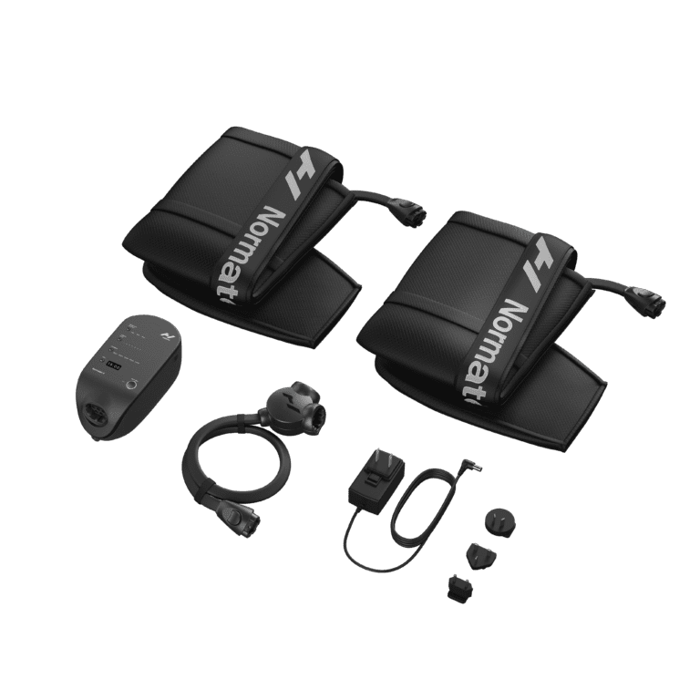 A set of black compression therapy devices, including two padded wraps with tubes labeled Normatec, a control unit, and connecting cables, arranged on a plain background.