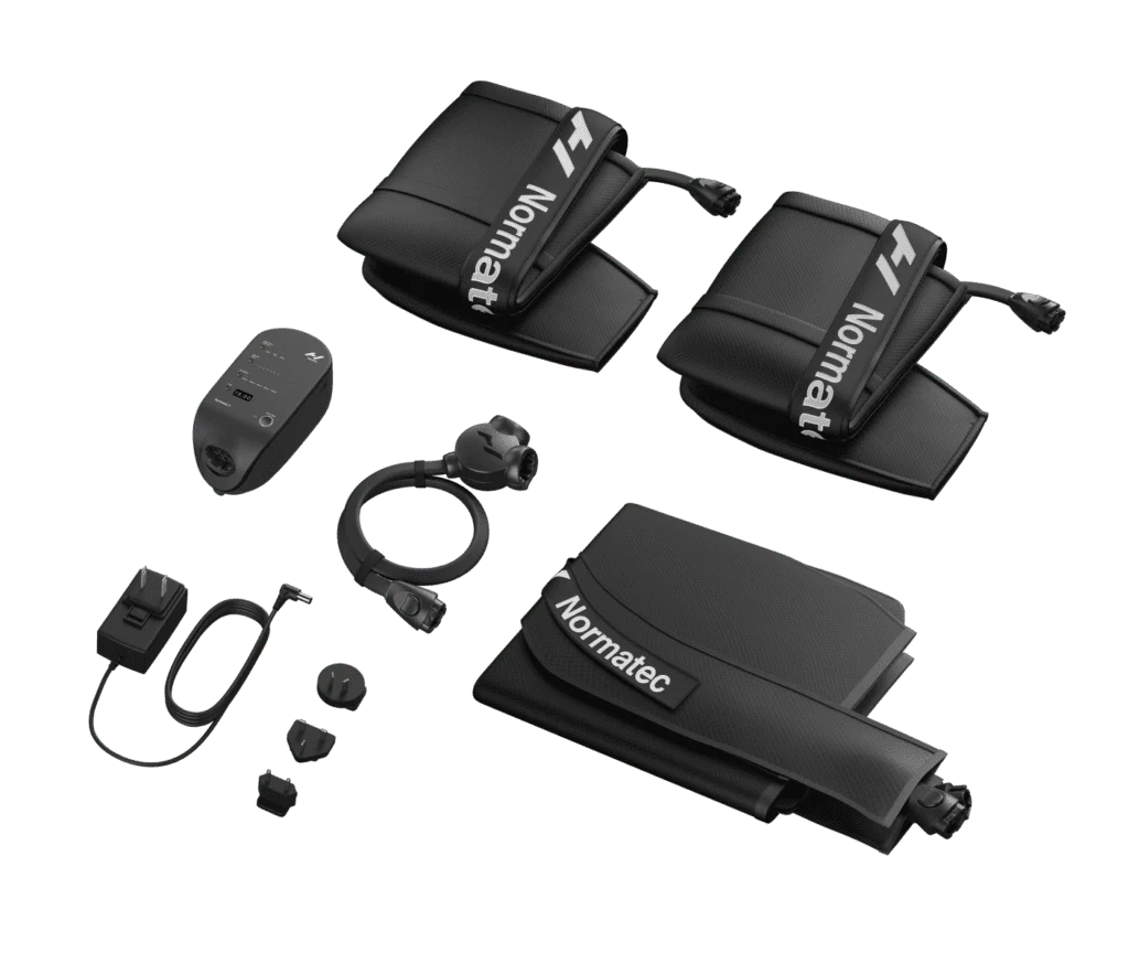 The Normatec 3 Lower Body System includes black recovery compression accessories with two sleeves prominently branded Normatec, a control unit, hoses, and various adapters.