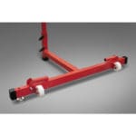The PowerMax Vertical Jump Trainer features a red metal base with black end caps and white wheels, set against a gray background.