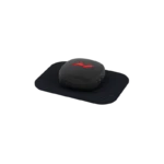 The Venom Go, a sleek black massage device, features a red logo and rests on a rectangular black mat. Enhanced with heat and vibration technology and including a USB charging port on the side, it sits against an elegantly simple plain black backdrop.