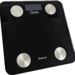 A black Dashr Biostation digital bathroom scale features four silver circular corner sensors, with the Dashr brand name near the top and a Bluetooth logo at the bottom.