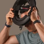 Athlete trying on Iron Neck head gear