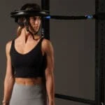 Athelte Demonstrating Iron Neck head gear and bungie cable
