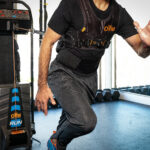 Athlete sprinting with the OHM Run Kinetic Trainer.