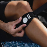 Firefly Recovery being positioned on athlete's leg.