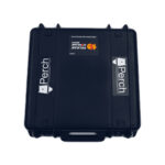 A black rugged case with the Perch logo on front and a rectangular Pelican Storm Case iM2375 sticker. It has latches, a textured exterior, designed for protecting and transporting equipment. Product: Perch Camera.