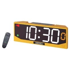 The Seiko DT40 LED Multi-Function Digital Timer and Scoreboard in yellow shows 10:30 with large white numbers, accompanied by a black remote control.