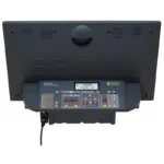 The Seiko KT601 Scoreboard controller features a digital display, multi-colored buttons, and an attached power cord, shown from an overhead and rear perspective.