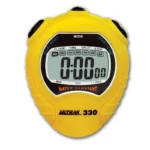 A yellow digital stopwatch displays 0:00.00 on its screen. The device shows days of the week above the digital numbers and has buttons labeled split/reset and start/stop. The brand Ultrak 330 is on the front.