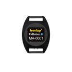 A black, oval-shaped electronic device labeled Freelap FxMotion Chip with a Bluetooth symbol, featuring two rectangular openings at the top and bottom.