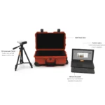 A VALD HumanTrak 3D camera on a tripod, a hard travel case, a custom laptop, and a wireless keyboard are arranged side by side with descriptive labels for each component.