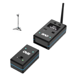 Two black OVR Performance Sprint Starter Kit wireless devices with blue accents (one featuring an antenna and display) sit on a white surface, with a tripod-mounted camera setup seen in the background.