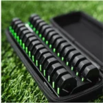 A close-up of PlayerData GPS units with green indicator lights, arranged neatly in a zippered carrying case on artificial grass.