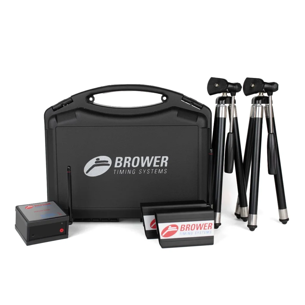 The Brower Black Box set, featuring a black carrying case, two tripods, two small timing sensors, and a timing device with the Brower logo, is arranged against a white background.