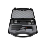 The Brower Black Box is a black hard case with foam padding, containing a small black tripod, a rectangular device with a red button, and other accessories neatly arranged in custom cutouts.