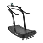 The TRUEFORM Trainer is a black curved manual treadmill featuring handrails, a display screen, and "TRUEFORM" written vertically on the side, with the model name "TRAINER" visible near the base.