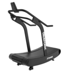 The TRUEFORM Trainer is a black, curved non-motorized treadmill with side handrails, featuring the TRUEFORM name on its frame, designed for indoor running or walking.