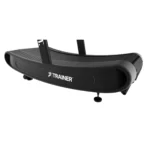 A close-up of the TRUEFORM Trainer, a black curved treadmill with "TRAINER" and a running figure logo on the side. It features a textured running surface and a sleek, modern design.