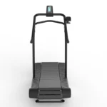 The TRUEFORM Trainer is a black manual treadmill featuring a curved running surface, dual side handrails, and a front digital display, displayed from the front on a white background.