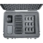 The Enode Pro – Charging Case is shown in black and white, featuring organized electronic accessories. The case neatly arranges cable bundles, rectangular components, and small identical pieces in separate foam compartments.