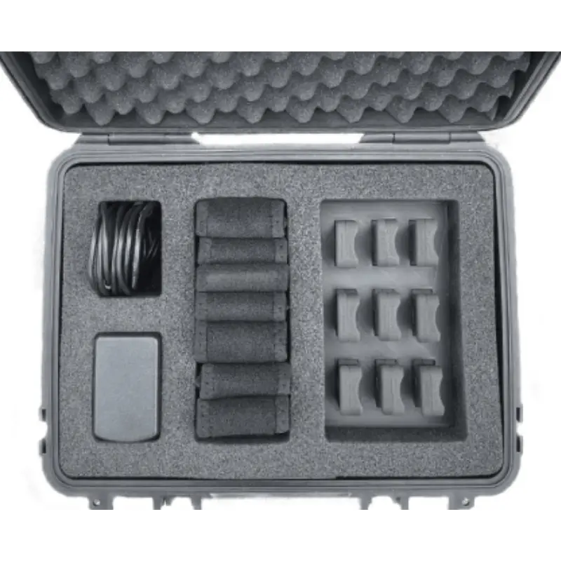 The Enode Pro – Charging Case is shown in black and white, featuring organized electronic accessories. The case neatly arranges cable bundles, rectangular components, and small identical pieces in separate foam compartments.
