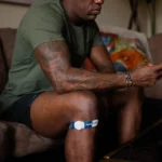 Athlete relaxing while using Firefly Recovery Devices.