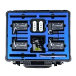 The GymAware 4 Unit Kit includes a black case with four devices, two white rectangular chargers, and various charging cables, all neatly arranged in a blue foam insert.