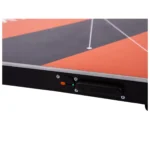 Close-up of the edge of a KINVENT 3D Delta Force Plate, a rectangular sports device with orange, black, and gray geometric patterns, featuring a small switch and a button labeled KINVENT on the side.