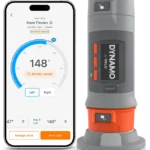A smartphone shows a knee flexion test app with a 148° angle, next to a gray and orange VALD Dynamo Plus (Copy) device, used for measuring joint movement.