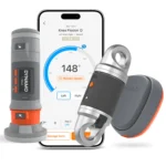 Three VALD ForceFrame devices, featuring gray and orange digital and metallic components, are shown in front of a smartphone displaying a knee flexion range-of-motion app with a 148-degree measurement.