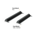 Two black and silver foot blocks from the kBox Ultimate System, one larger and one smaller, both featuring angled supports and non-slip surfaces, are displayed on a white background.
